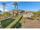 Single-story home with a three-car garage and spacious lawn at 1604 E Sheena Dr, Phoenix, AZ 85022