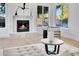 Modern fireplace with marble surround in a bright living room at 1604 E Sheena Dr, Phoenix, AZ 85022