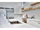 Modern kitchen sink and faucet with white quartz countertops at 1604 E Sheena Dr, Phoenix, AZ 85022