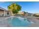 Inviting freeform pool with a large paved patio and mountain views at 1604 E Sheena Dr, Phoenix, AZ 85022