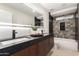 Modern bathroom with double vanity, large mirror, and updated fixtures at 16446 N 56Th Way, Scottsdale, AZ 85254