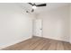 Light-filled bedroom with wood-look floors and a door at 16446 N 56Th Way, Scottsdale, AZ 85254