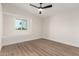 Well-lit bedroom featuring a window seat and ceiling fan at 16446 N 56Th Way, Scottsdale, AZ 85254