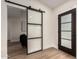 Modern entryway with barn door and sleek flooring at 16446 N 56Th Way, Scottsdale, AZ 85254