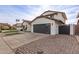 Landscaped front yard with paver driveway and garage at 16446 N 56Th Way, Scottsdale, AZ 85254