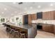 Contemporary kitchen with dark cabinetry and expansive island at 16446 N 56Th Way, Scottsdale, AZ 85254