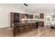 Modern kitchen featuring island, stainless steel appliances, and hardwood floors at 16446 N 56Th Way, Scottsdale, AZ 85254