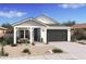 One-story home with gray siding, white trim, and a dark gray garage door at 16640 N Dante Way, Maricopa, AZ 85138