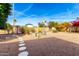 Backyard with a windmill and a stone pathway at 1724 W 15Th Ave, Apache Junction, AZ 85120