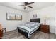 Cozy bedroom with ceiling fan and wooden dresser at 1724 W 15Th Ave, Apache Junction, AZ 85120