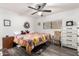 Bright bedroom with a ceiling fan and large bed at 1724 W 15Th Ave, Apache Junction, AZ 85120