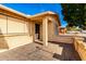 House entrance with brick columns and a decorative door at 1724 W 15Th Ave, Apache Junction, AZ 85120