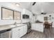 White kitchen with stainless steel appliances and view to dining area at 1724 W 15Th Ave, Apache Junction, AZ 85120