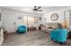 Living room with teal armchairs and neutral sofa at 1724 W 15Th Ave, Apache Junction, AZ 85120