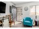 Living room with teal armchair and wood floors at 1724 W 15Th Ave, Apache Junction, AZ 85120