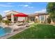 Landscaped backyard with pool, patio furniture, and lawn at 1805 W Parnell Dr, Phoenix, AZ 85085