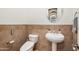 Modern bathroom with a pedestal sink and a toilet at 1805 W Parnell Dr, Phoenix, AZ 85085