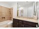 Bathroom with double sinks and a shower/tub combo at 1805 W Parnell Dr, Phoenix, AZ 85085