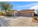 Three car garage and welcoming front porch at 1805 W Parnell Dr, Phoenix, AZ 85085