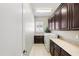 Bright laundry room with built-in cabinets and modern washer and dryer at 1805 W Parnell Dr, Phoenix, AZ 85085