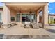 Relaxing covered patio with comfortable seating and ceiling fans at 1805 W Parnell Dr, Phoenix, AZ 85085