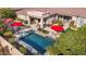 Inviting pool and spa area with red umbrellas at 1805 W Parnell Dr, Phoenix, AZ 85085