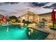 Luminous pool and spa at dusk with lounge seating at 1805 W Parnell Dr, Phoenix, AZ 85085