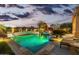 Scenic pool and spa at dusk with a bridge and fountain at 1805 W Parnell Dr, Phoenix, AZ 85085