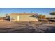 Rear view of a single-story house with a spacious yard at 1814 S 363Rd Ave, Tonopah, AZ 85354