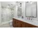 Elegant bathroom with marble shower, double vanity, and modern fixtures at 1841 E Secretariat Dr, Tempe, AZ 85284