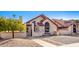 Tan two-story home with tile roof, walkway, and small front yard at 1841 E Secretariat Dr, Tempe, AZ 85284