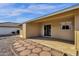 Backyard with patio, storage shed, and a stone pathway at 18625 N 103Rd Ave, Sun City, AZ 85373