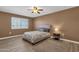 Cozy bedroom with a full-size bed and light flooring at 18625 N 103Rd Ave, Sun City, AZ 85373