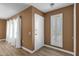 Bright entryway with light flooring and white door at 18625 N 103Rd Ave, Sun City, AZ 85373