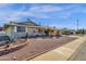 Single-story home with desert landscaping and a large front yard at 18625 N 103Rd Ave, Sun City, AZ 85373