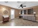 Laundry room with built-in shelving, a utility sink, and washer/dryer at 18625 N 103Rd Ave, Sun City, AZ 85373