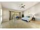 Main bedroom with high ceilings, bay window, and ceiling fan at 18903 N 87Th Dr, Peoria, AZ 85382