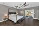 Spacious bedroom with a four poster bed, and sliding glass door to balcony at 19034 N 94Th Way, Scottsdale, AZ 85255