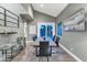 Modern dining room with sleek table and chairs, and backyard views at 19034 N 94Th Way, Scottsdale, AZ 85255