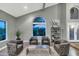 Elegant living room with high ceilings and large windows at 19034 N 94Th Way, Scottsdale, AZ 85255