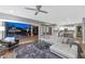 Open floor plan living room with a view of the pool and kitchen at 19034 N 94Th Way, Scottsdale, AZ 85255