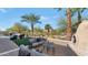 Outdoor patio with seating area, fire pit, and artificial turf at 19034 N 94Th Way, Scottsdale, AZ 85255