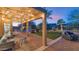 Covered patio with string lights, comfortable seating, and backyard views at 19034 N 94Th Way, Scottsdale, AZ 85255