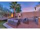 Outdoor patio with a fireplace and built-in grill, perfect for entertaining at 19034 N 94Th Way, Scottsdale, AZ 85255