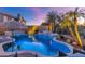 Relaxing freeform pool with a spa and plenty of seating at 19034 N 94Th Way, Scottsdale, AZ 85255