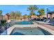 Inviting backyard oasis with a large pool, spa, and comfortable lounge area at 19034 N 94Th Way, Scottsdale, AZ 85255