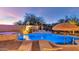 Inviting kidney-shaped pool with waterfall feature and lounge chairs at 19034 N 94Th Way, Scottsdale, AZ 85255