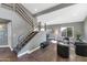 Modern staircase with metal railing and tile flooring at 19034 N 94Th Way, Scottsdale, AZ 85255