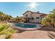 Home with kidney-shaped pool and desert landscaping at 1918 E Hearn Rd, Phoenix, AZ 85022