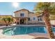 Inviting kidney-shaped pool with patio and lush landscaping at 1918 E Hearn Rd, Phoenix, AZ 85022